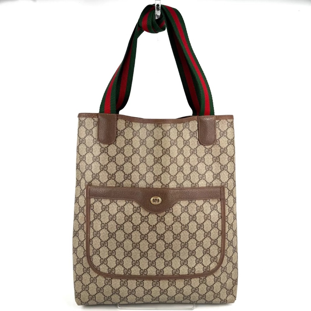 Gucci Sherry Line Monogram Tote with an outer pocket and spacious interior.